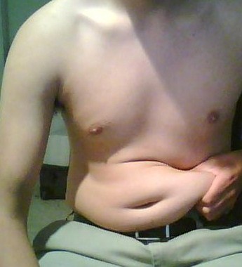 white male with bare torso and thick fold of pinched fat - this is not a flat tummy!