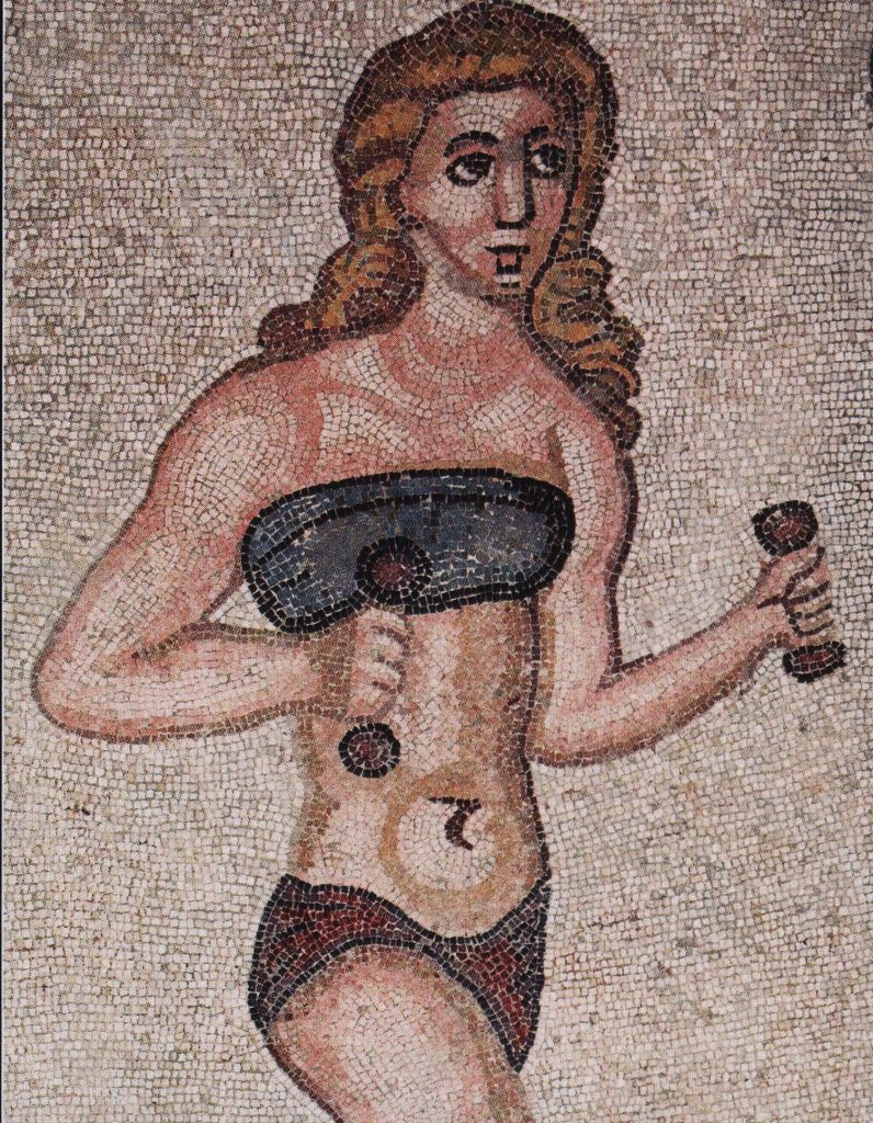 mosaic of a white skinned woman with long red hair, wearing a blue bikini and holding dumbells 4th century AD 