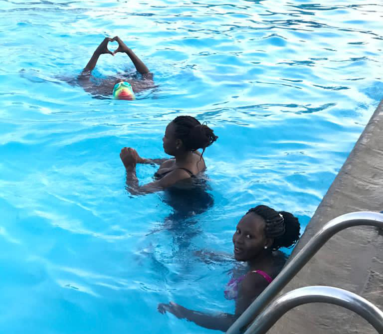 three black girls in swimming pool