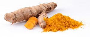Light brown tuber and bright orange-yellow powder of turmeric, on white background